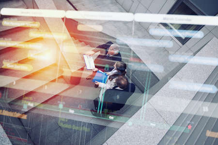 Business people that work together in office. Concept of teamwork and partnership. Double exposure