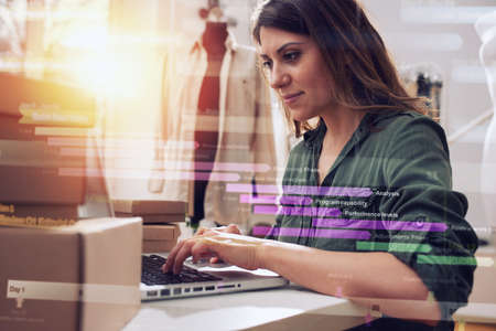 Seamstress works to new clothes ordered by internet client