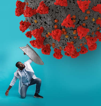 Doctor with metal shield defending from covid 19 disease on cyan background