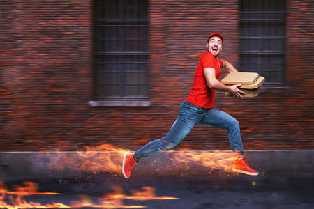 Courier runs fast to deliver quickly pizzas with fiery feet.の写真素材