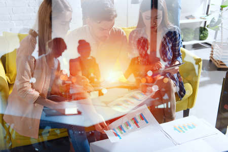 Business people that work together in office with statistics. Concept of teamwork and partnership