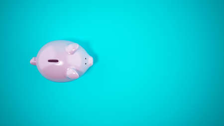 Pink piggy bank on cyan background. Top view. 3D Renderingの写真素材