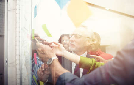Team of happy people work together. concept of teamwork, partnership and successの写真素材