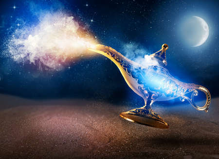 Smoke exists from magic aladdin genie lamp in a desertの写真素材