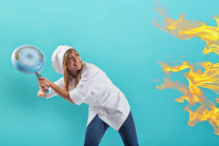 Woman chef is worried becouse the kitchen is on fire