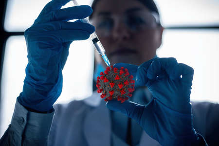 Doctor in the laboratory is testing new treatments on virus. Pharmaceutical conceptの写真素材
