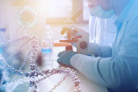 Doctor in the laboratory analyzes samples under a microscope. Pharmaceutical treatment concept.