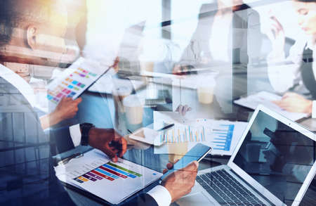 Team of people work together on company statistics. concept of teamwork and partnership.