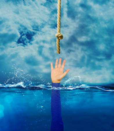Person is drowning and needs help. concept of crisis and problemの写真素材