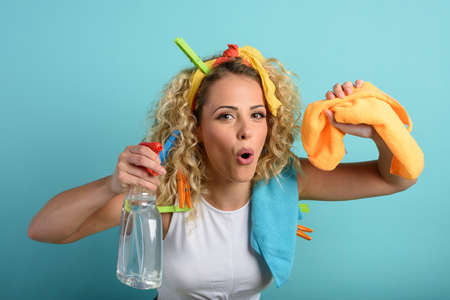 Funny housewife cleans and disinfects to keep germs, viruses and bacteria away.の写真素材