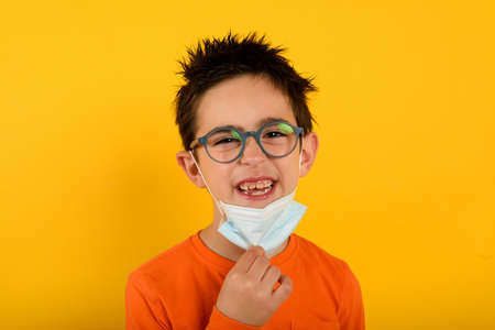 Child is happy to remove the face maskの写真素材