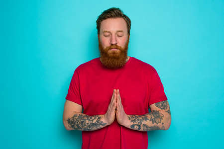 Man with beard asks to be forgiven and prays