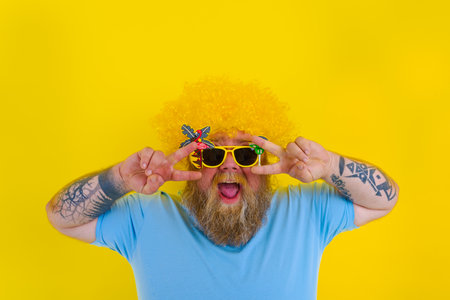 Fat man with wig in head and sunglasses dances