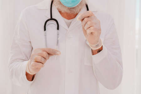 Doctor is checking the  virus with a testerの写真素材