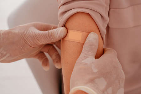 Patient with patch on the arm did the  vaccineの写真素材