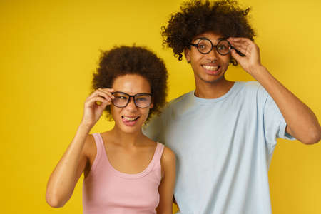 Happy couple joke together by making grimaces