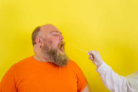 man with beard and tattoos does the testの写真素材