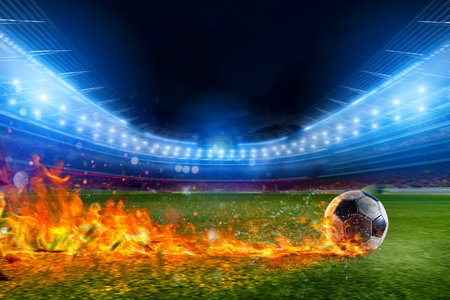 Soccer ball in flame goes fast to the stadium fieldの写真素材