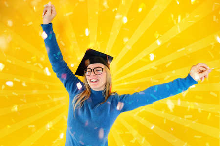Woman is happy to have achieved graduation and success in studiesの写真素材