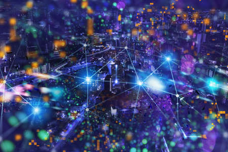 Fast internet connection in the city at nightの写真素材