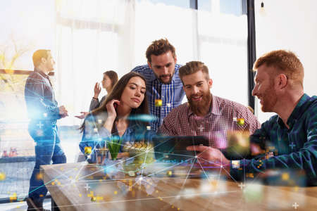 Business teamwork works with a tablet with internet streaming serviceの写真素材