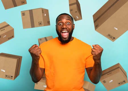 Black man is happy to receive a lot of packagesの写真素材
