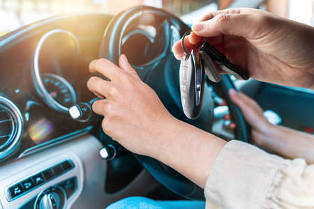 Woman drives a new purchased modern car