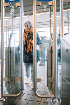 Senior woman enables ticket to takes the train