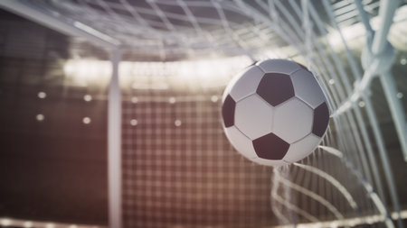 Close up of a soccer ball scoring a goalの写真素材