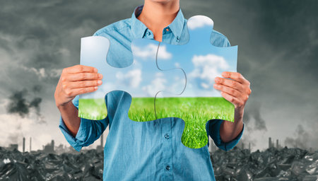 Rebuild with puzzles a landscape polluted by smog, rubbish and pollutionの写真素材