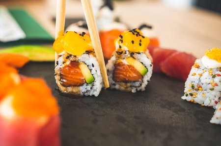 Close up of tasty japanese uramaki sushi with salmonの写真素材