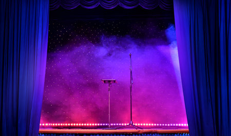 Elegant theatre show with colored spotlights and microphoneの写真素材