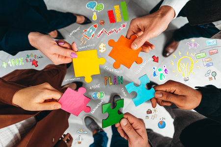 Teamwork of partners connect puzzle pieces as integration and startupの写真素材