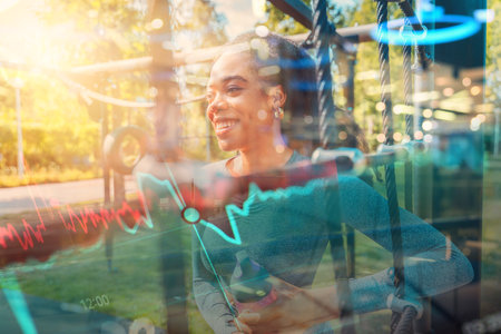 Woman runs and does fitness exercises outdoor in a sunny dayの写真素材