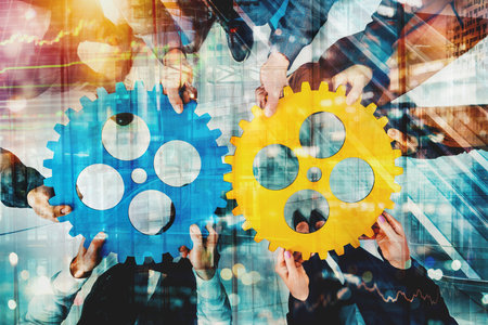 Business team work together and combine pieces of gears. Partnership and integration conceptの写真素材