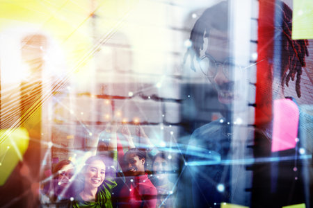 Teamwork and brainstorming concept with businessmen sharing an idea with a lampの写真素材