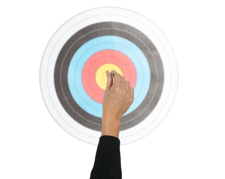 Business person tries to center the target with the arrowの写真素材