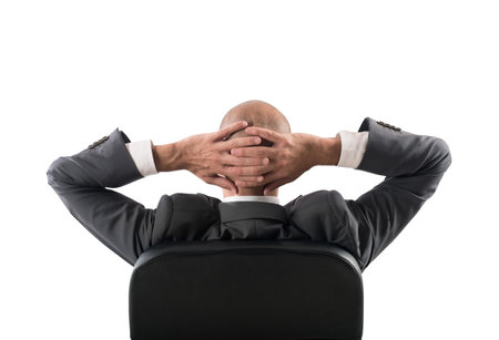 Successful businessman is relaxing after a stressed day of workの写真素材