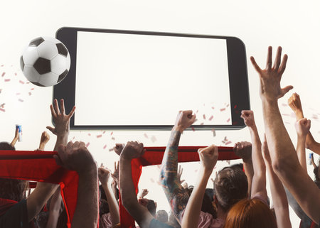 Watch a live sports event on your mobile device. betting on football matchesの写真素材