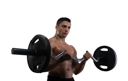Athletic muscular man training biceps at the gymの写真素材