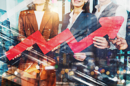 Business teamwork hold a red arrow as growing, successful and profit concept