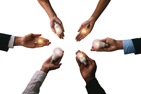 Teamwork and brainstorming concept with businessmen that share an idea with a lamp
