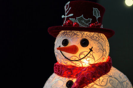 Glowing snowman wearing burgundy top hat and scarf celebrates christmas festivitiesの素材
