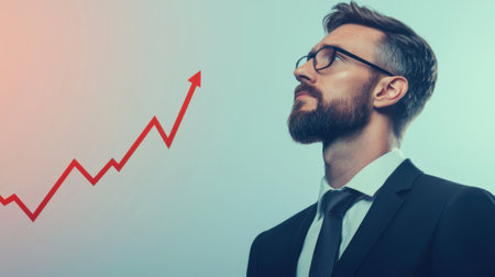 Businessman looking at growing arrow representing business successの素材