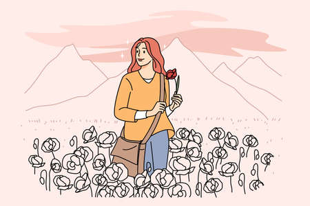 Happy woman walking on meadow alone