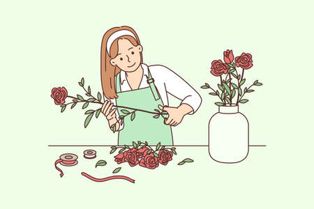 Female florist working with flowers in workshopのイラスト素材