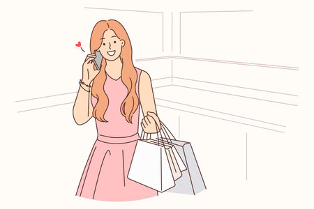 Happy woman with shopping bags talking on cellのイラスト素材