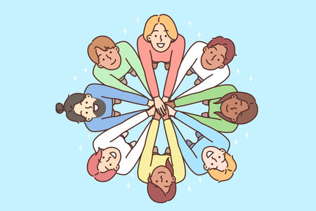 Multiracial people stand in circle with hands outstretched to demonstrate friendship
