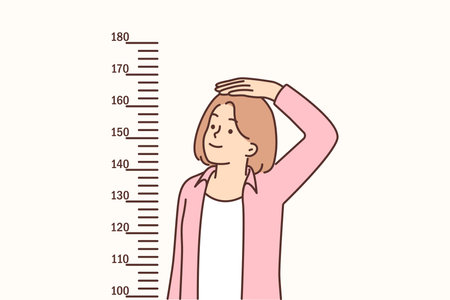 Teenage girl measures height standing near marks on wall, wanting to become tallのイラスト素材