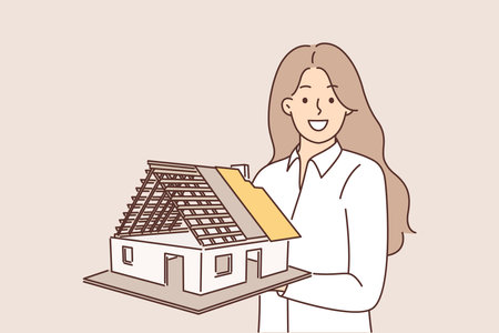 Woman architect holds model of house, demonstrating engineering solution for construction buildingsのイラスト素材